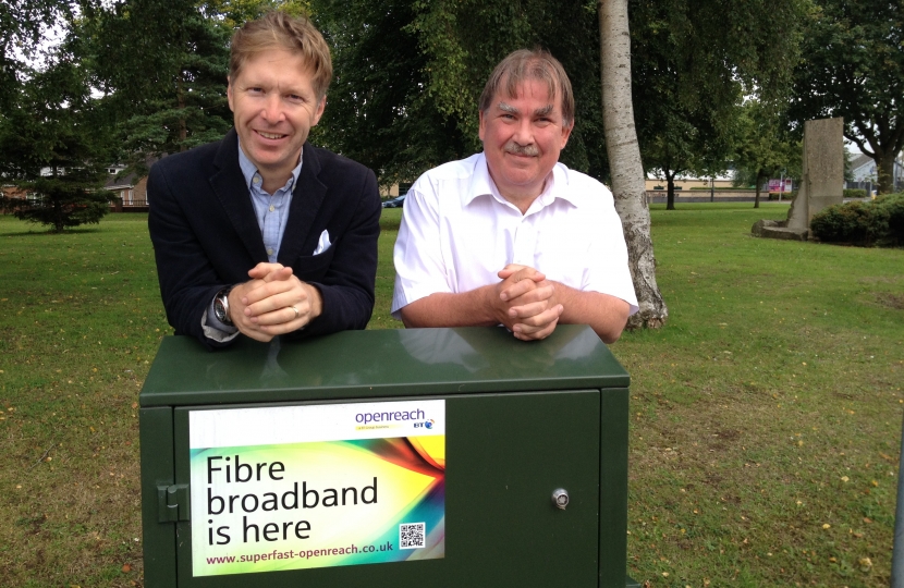 Cllrs' Ben Stokes and Steve Reade with broadband distribution cabinate